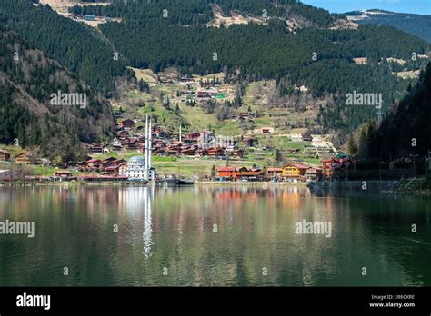 Mosque reflected in the clear waters of Uzungöl Lake, Çaykara District ...