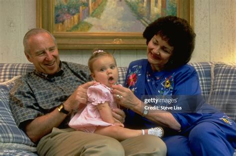 Former astronaut Jim Lovell & wife Marilyn cuddling w. granddaughter ...