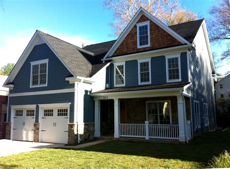 This Bethesda home features Hardie Plank siding, Falcon Mist stone and cedar shake accent in the ...