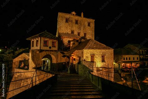 Famous rebuilt historic bridge in downtown Mostar at night Stock Photo ...