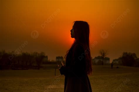 Sunset Silhouette Of A Girl In The Sunset Background, Sunset, Silhouette, Girl Background Image ...