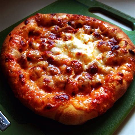 Homemade spicy Italian sausage pizza with fresh mozzarella, parmesan ...