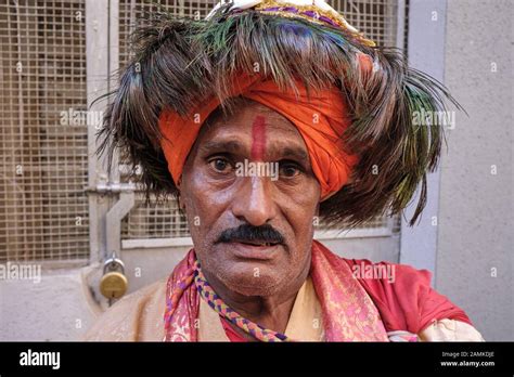 A Vasudev, i.e. a worshipper of Hindu god Krishna in the Indian state of Maharashtra, singing ...