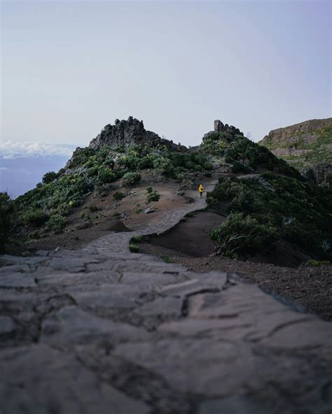 Person Hiking on Mountain Path · Free Stock Photo