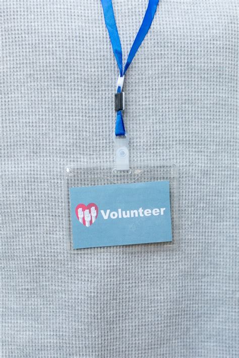 Free Photo | Close up volunteer card hanging