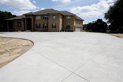 Plain concrete driveway with brushed swirled texture | Scott Schupbach Concrete