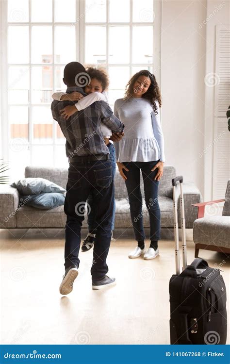 Happy Black Family Excited Reuniting with Father at Home Stock Photo - Image of black, domestic ...