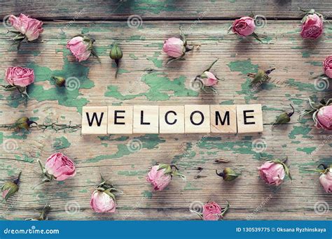 Welcome Sign and Small Pink Roses on Wooden Background. Stock Image ...