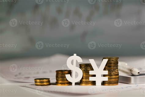 Cutouts Chinese yuan sign at stacks of coins. 24987645 Stock Photo at ...