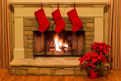 Cozy Holiday Scene in Front of Decorated Stone Fireplace with Four Christmas Stockings. Stock ...