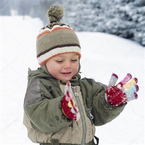 Child playing with snow — Stock Photo © pavsie #32633307