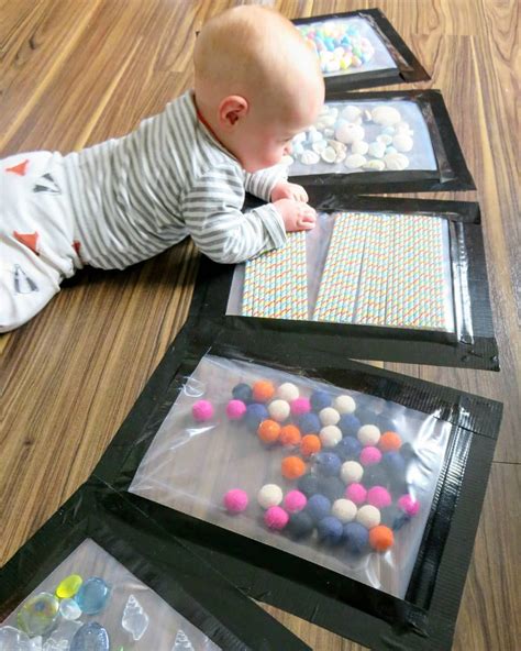 These sensory plates are just genius! Right on the floor where baby can touch and feel. Baby ...