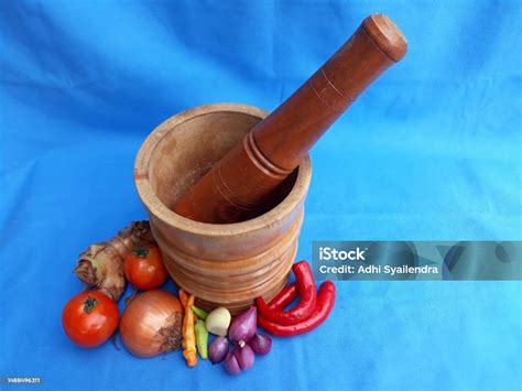 Wooden Lumpang Alu Or Mortar And Pestle For Pounding Or Grinding Spices Herbs With Onion Garlic ...