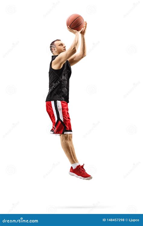 Male Basketball Player Jumping and Shooting a Ball Stock Photo - Image ...