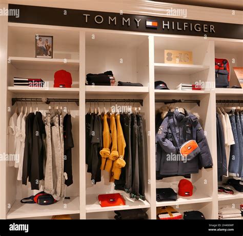 TOMMY HILFIGER CLOTHING ON DISPLAY INSIDE THE FASHION STORE Stock Photo - Alamy