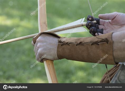 Archer with medieval English longbow and arrows. Sport and recreation concept. Stock Photo by ...