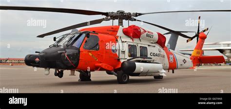 U.S. Coast Guard MH-60 Jayhawk rescue helicopter parked on the runway ...