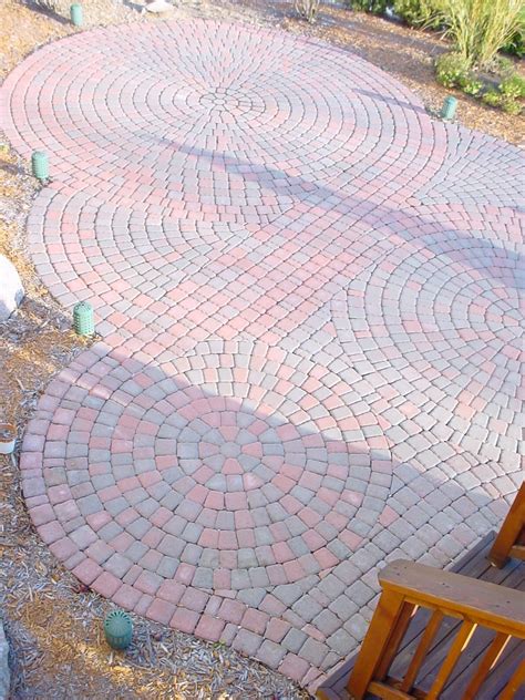 Circular pattern red brick paver patio in Northville Design and ...