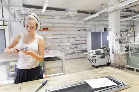 Technician working in optical laboratory - Stock Image - F009/1255 - Science Photo Library