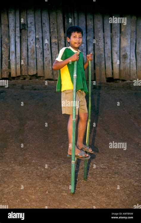 Walking on bamboo stilts hi-res stock photography and images - Alamy