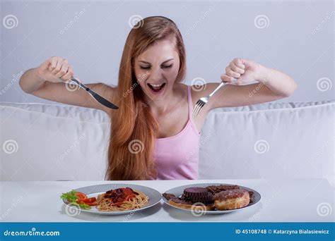 Girl Eating a Lot of Food at Once Stock Photo - Image of hunger, large: 45108748