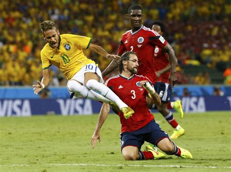 Neymar being fouled in the World Cup 2014, in Brazil vs Colombia ...