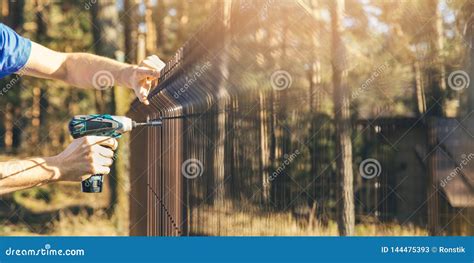 Fencing - Worker Installing Metal Wire Mesh Fence Panel Stock Image - Image of blank, border ...