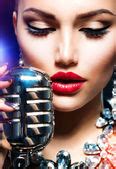 Singing Woman with Retro Microphone — Stock Photo © Subbotina #24593603