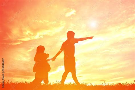 Silhouette children playing on sunset Stock Photo | Adobe Stock