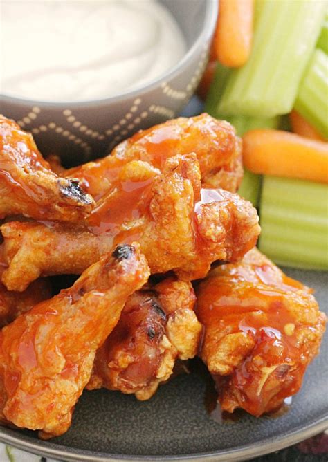 Crispy Baked Chicken Wings - with the best buffalo sauce - Foodtastic Mom