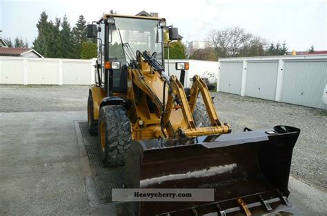 CAT 906 2002 Wheeled loader Construction Equipment Photo and Specs