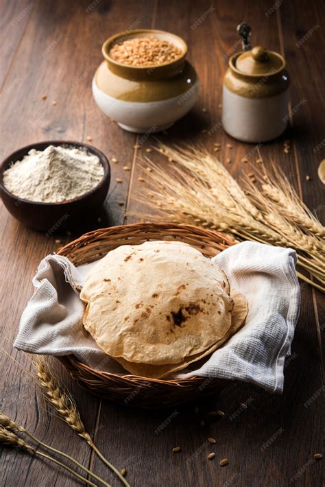 Premium Photo | Indian chapati or fulka or gehu roti with wheat grains ...