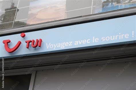 TUI logo brand and text blue smiling sign of facade office travel ...