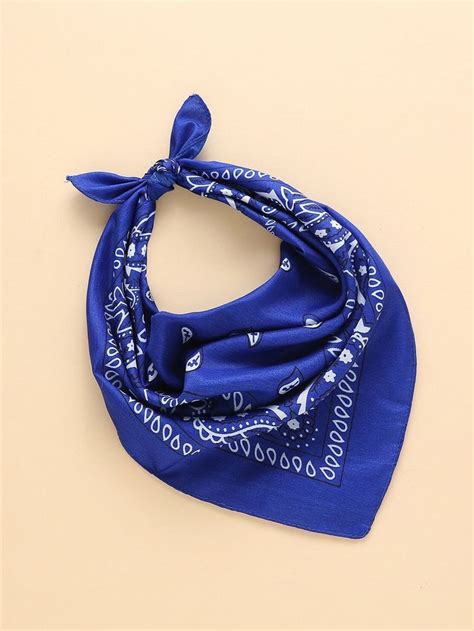 a blue bandana on a beige background with the words, love is in the air