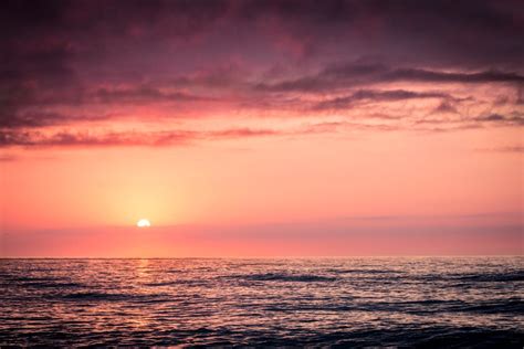 Photo of Blue Ocean and Dark Clouds during Sunset · Free Stock Photo