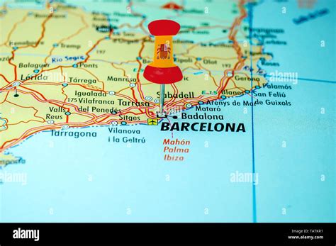 Push pin with spain flag stuck on a map centered on the city of ...