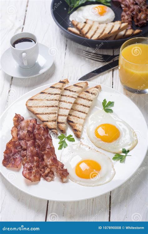 Breakfast with Eggs Bacon and Toasts Stock Photo - Image of delicious, nutrition: 107890008