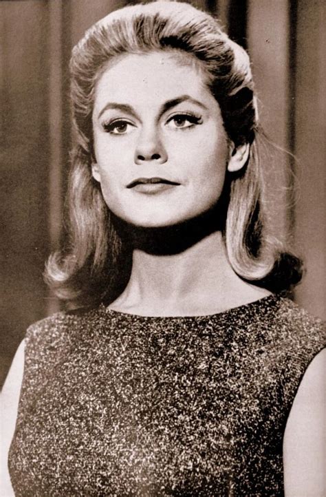 an old black and white photo of a woman with blonde hair wearing a sleeveless dress