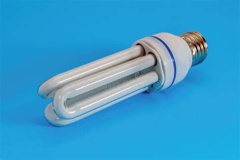 Energy Saving Fluorescent Light Bulb Close-up on a Blue Background Stock Image - Image of idea ...