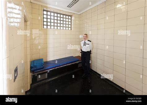 Metropolitan Police WPC woman officer in a Police station custody suite ...