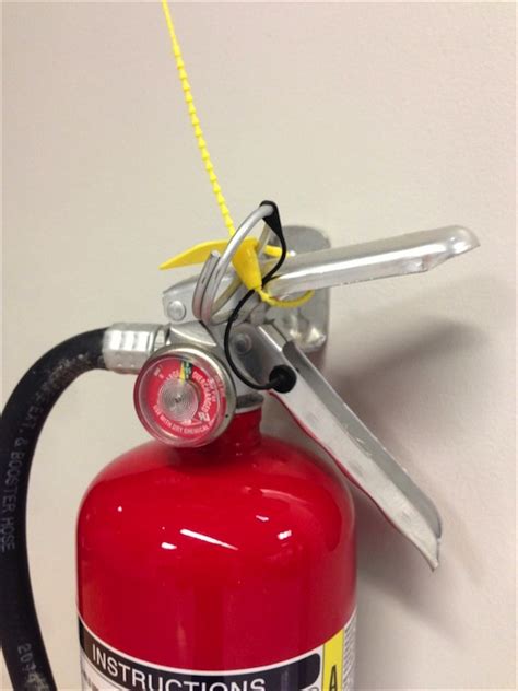 Why is there a beaded tie on new fire extinguishers? - Home Improvement ...
