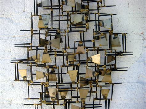 A vintage 1960's hand wrought abstract metal wall sculpture at 1stdibs