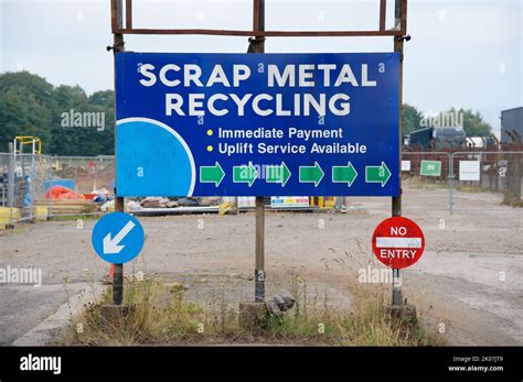 Scrap metal recycling sign at visitors entrance Stock Photo - Alamy