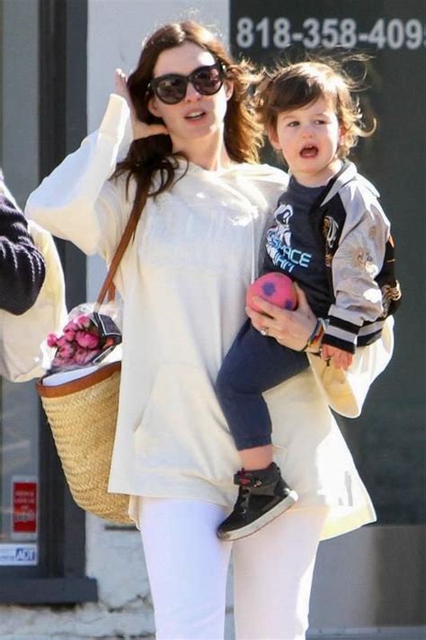 Anne Hathaway left a farmers market in Studio City, California, with son Jonathan Shulman on ...