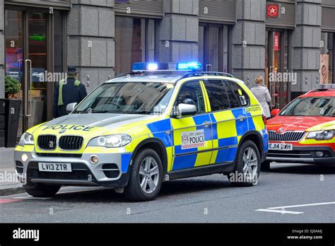 Blue lights on City of London BMW police car crew attending a street ...