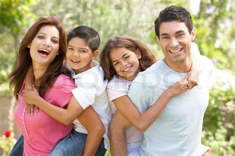 Portrait of Happy Family In Park | Stock Photo | Colourbox