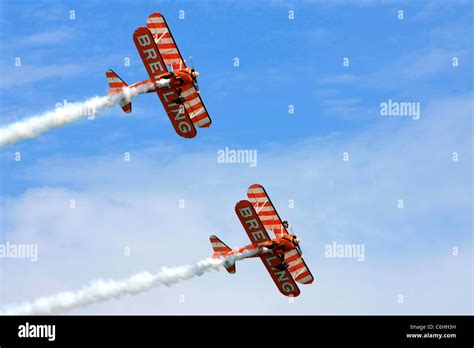 The Breitling Wing-walking aerobatics display team Stock Photo - Alamy