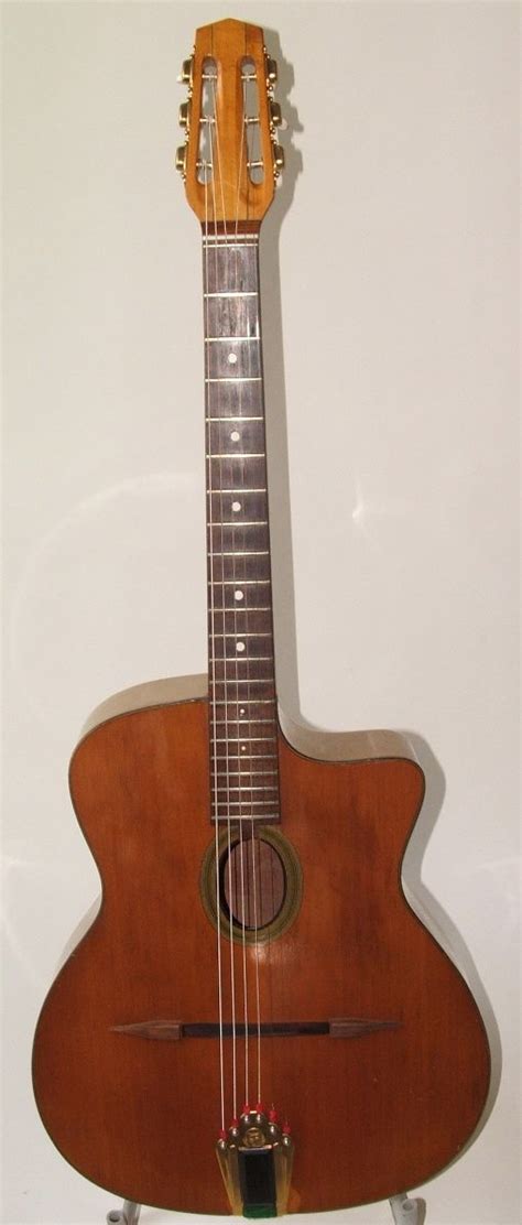 A beautiful example of a classic gypsy guitar. Guitar Musical Instrument, Jazz Guitar, Guitar ...