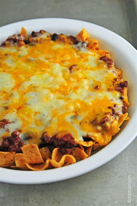 Frito Chili Pie - 2 cups Fritos corn chips, 3 cups chili, 8oz. cheddar cheese, 8oz. Monterrey ...