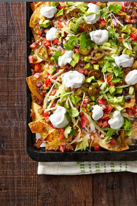 Best Loaded Nachos Recipe - How to Make Loaded Nachos - CountryLiving.com